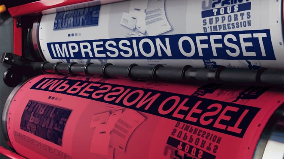 Rouleaux d'une presse offset imprimant les mots « Impression offset » en bleu et rouge, aux couleurs de l'imprimeur Uprint