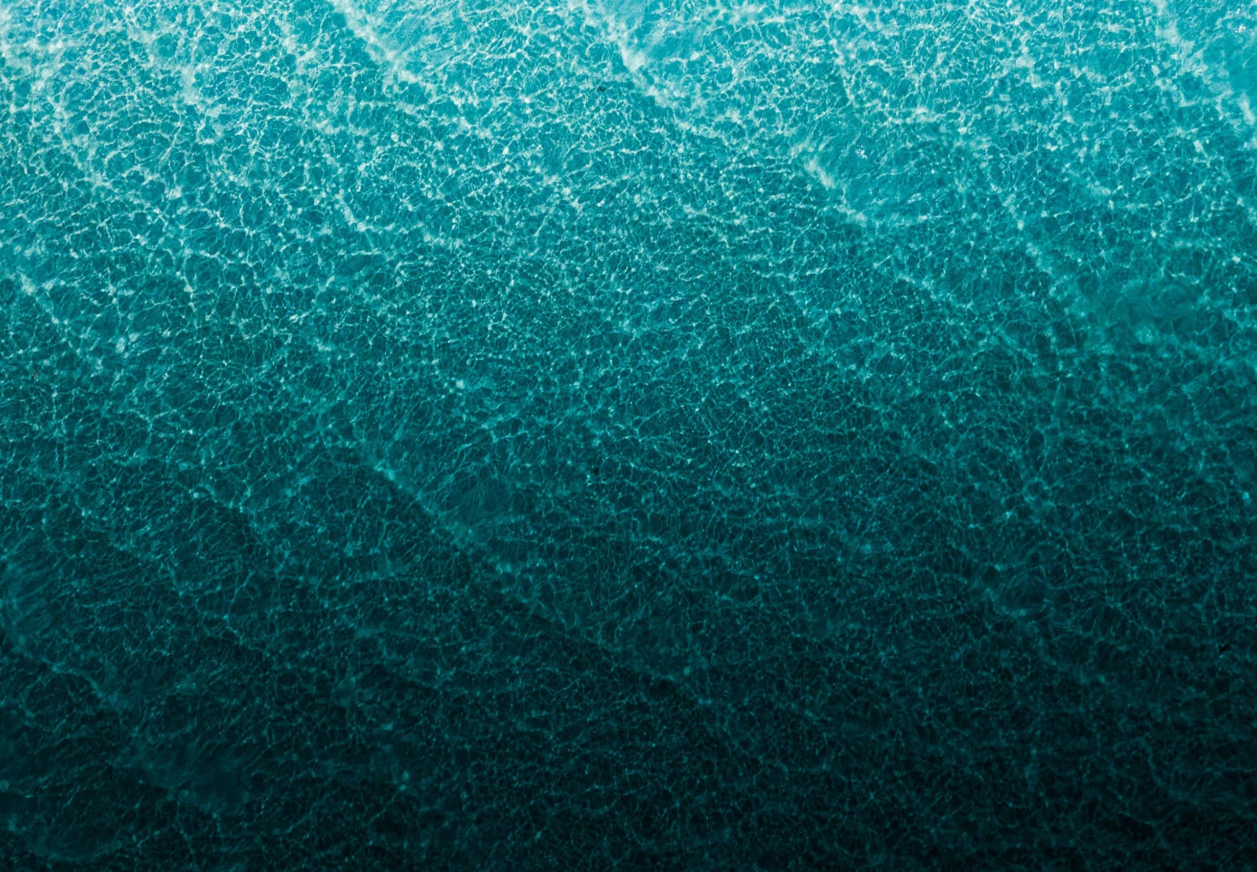 Eau turquoise vue du dessus, bannière du projet Rêv ti dodo, charte graphique par le Studio Citron Sorbet, graphiste à Nantes